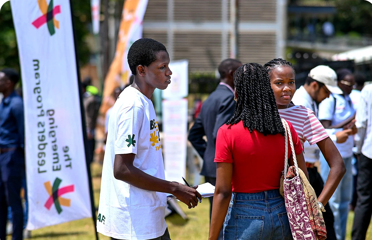 Students walking together at an ELP campus engagement, beside an ELP banner.